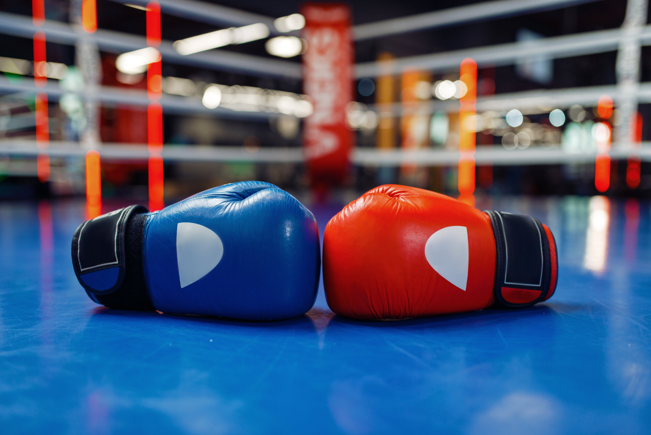 Pair of leather boxing gloves on ring, nobody