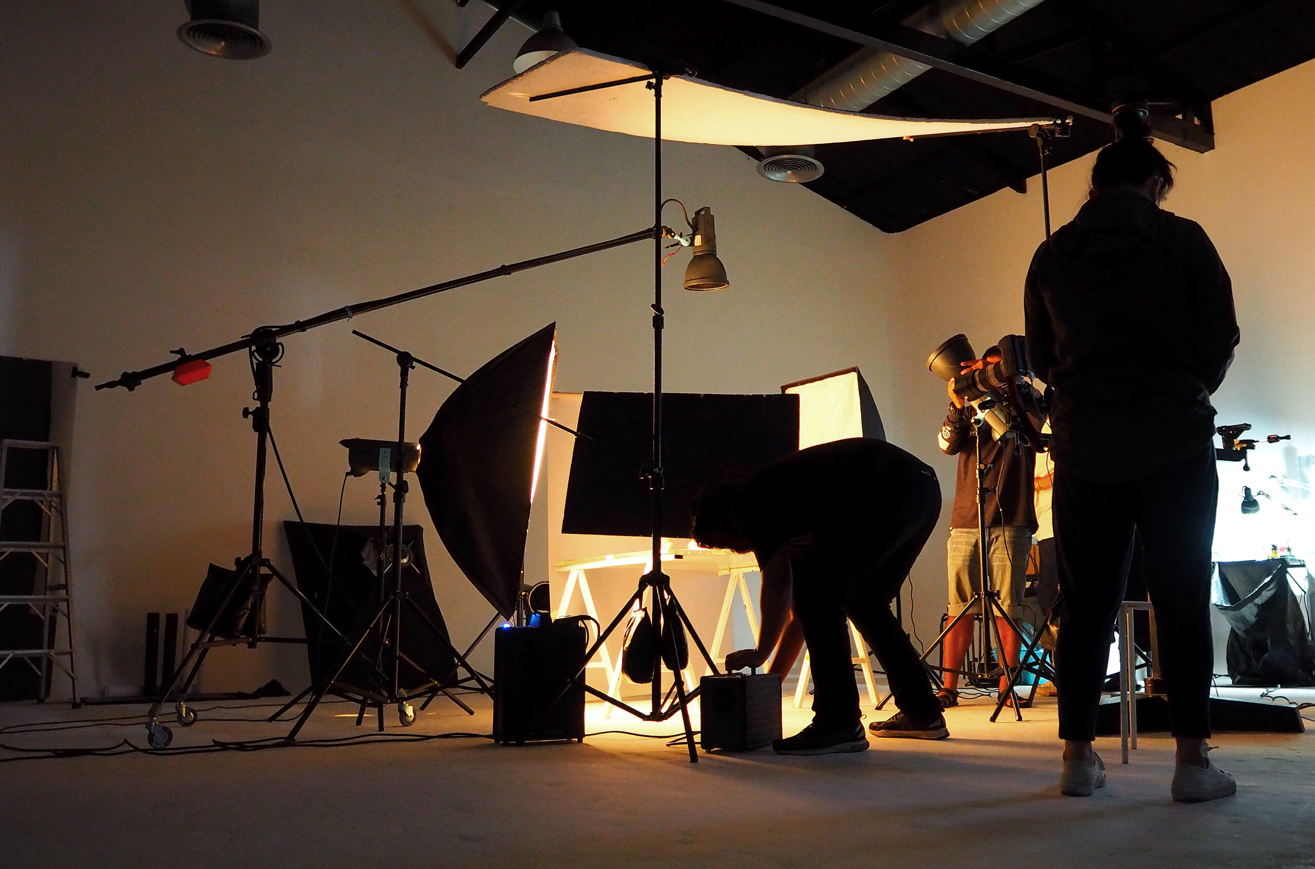 Silhouette of people working in production studio.